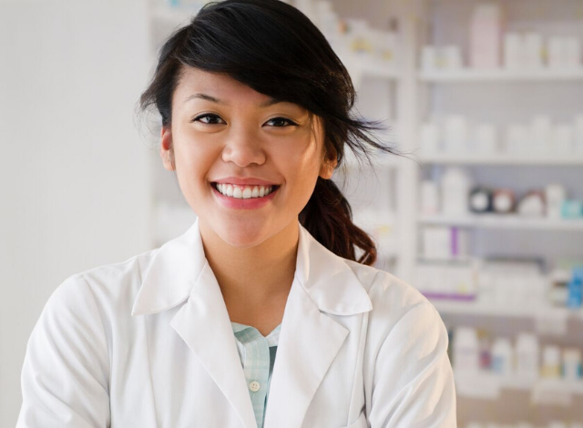 pharmacist smiling before administrating the HPV vaccine