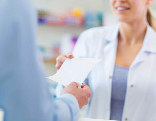 pharmacist receiving prescription pharmacist receiving prescription
