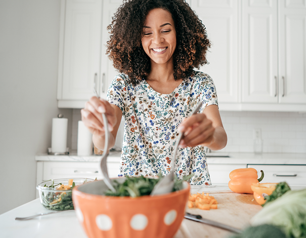 Woman making a bowl of salad - Fibres