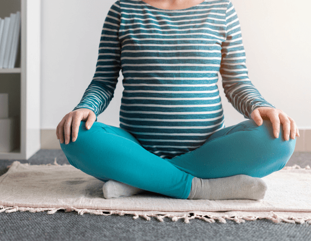 Pregnant Woman doing yoga Pregnant Woman doing yoga