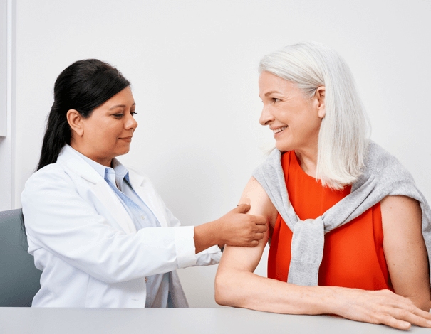 elder women getting Shingles vaccine
