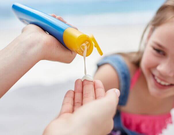 Applying sunscreen