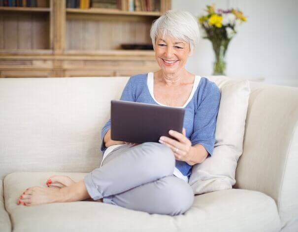 woman reading on tablet Woman reading about diabetes online